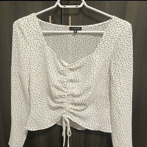 White and black polka dot blouse